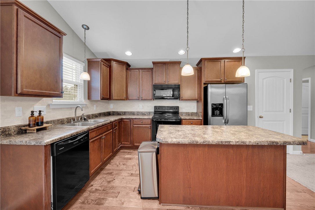 138 Madison Pointe Drive Seneca, SC 29678 - Photo 11 of 42 This spacious kitchen offers ample cabinet space and modern appliances, perfect for everyday living.