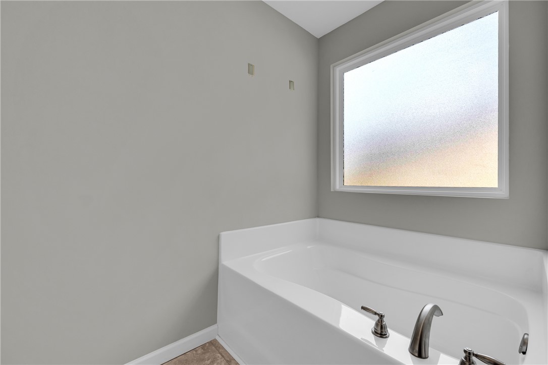 138 Madison Pointe Drive Seneca, SC 29678 - Photo 21 of 42 Relax in this tranquil bathing space featuring a large tub and frosted window.