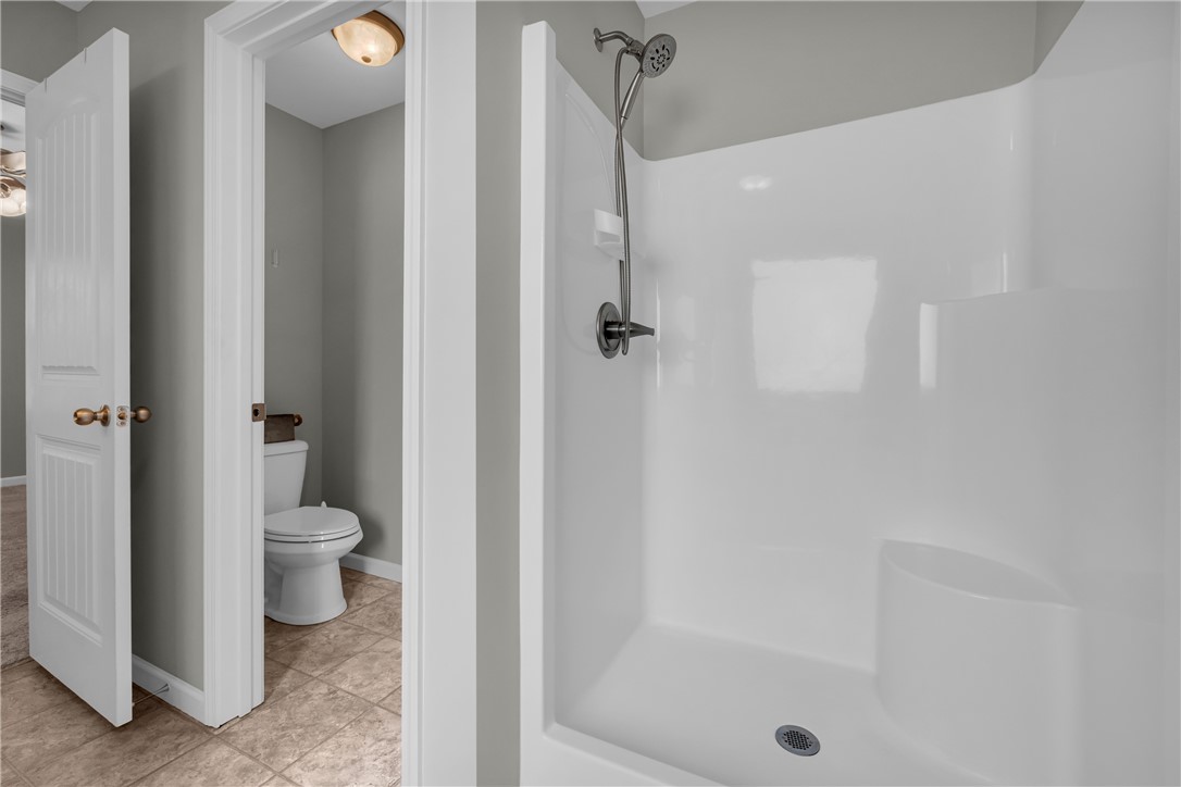 138 Madison Pointe Drive Seneca, SC 29678 - Photo 22 of 42 This clean bathroom features a convenient shower and a separate water closet.