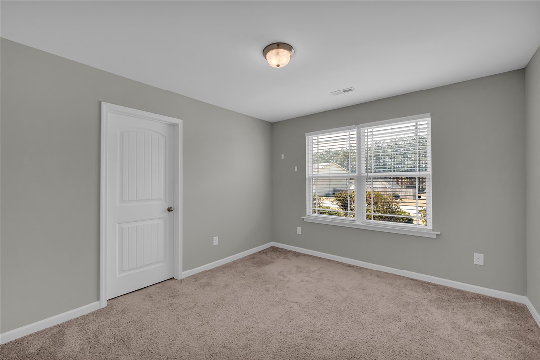 138 Madison Pointe Drive Seneca, SC 29678 - Photo 25 of 42 This bright and airy room offers a comfortable space with abundant natural light.