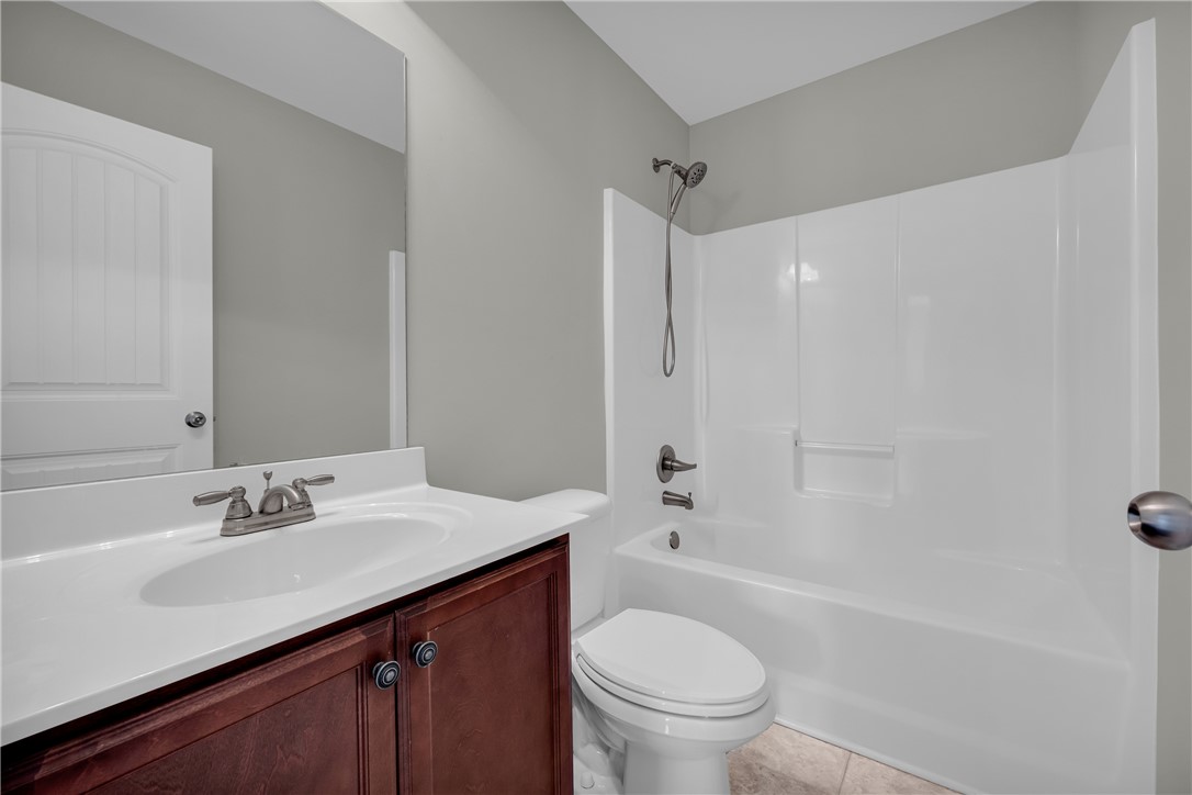 138 Madison Pointe Drive Seneca, SC 29678 - Photo 29 of 42 This clean and functional bathroom features a single vanity and a shower-over-tub combination.
