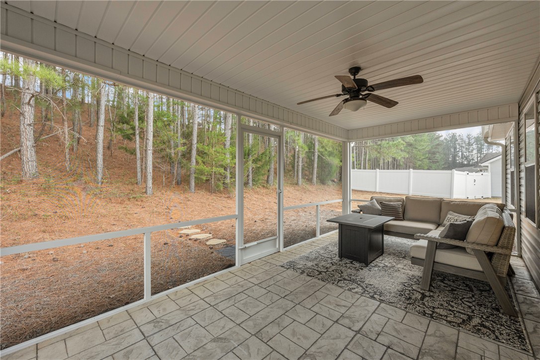 138 Madison Pointe Drive Seneca, SC 29678 - Photo 35 of 42 This spacious screened porch offers tranquil outdoor living with views of lush greenery.