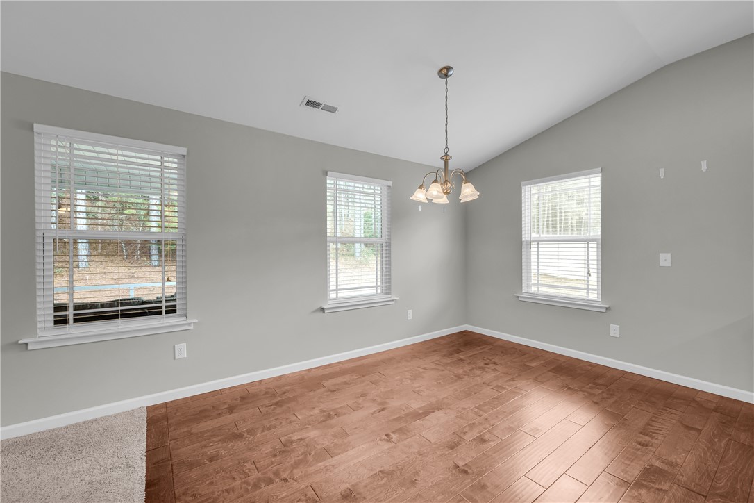 138 Madison Pointe Drive Seneca, SC 29678 - Photo 9 of 42 This bright and airy room features elegant flooring and abundant natural light.