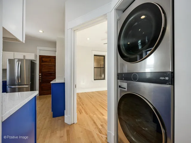 a view of a hallway with washer and dryer