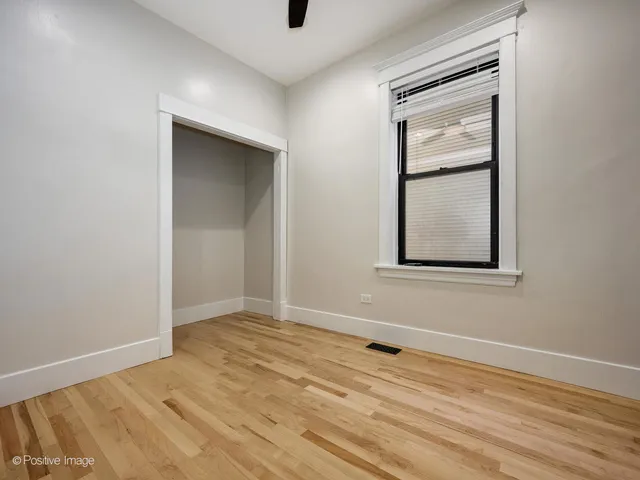 an empty room with a empty space and windows