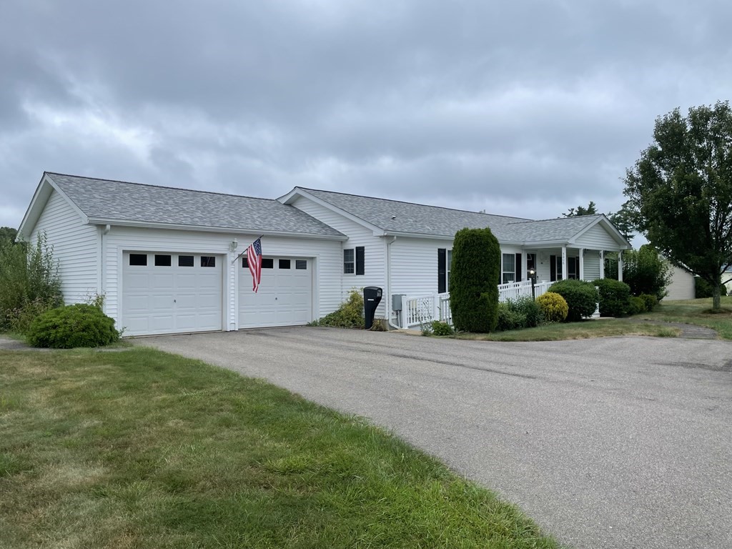3006 Green Street Middleboro, MA 02346 - Photo 1 of 34 a front view of a house with a yard and garage