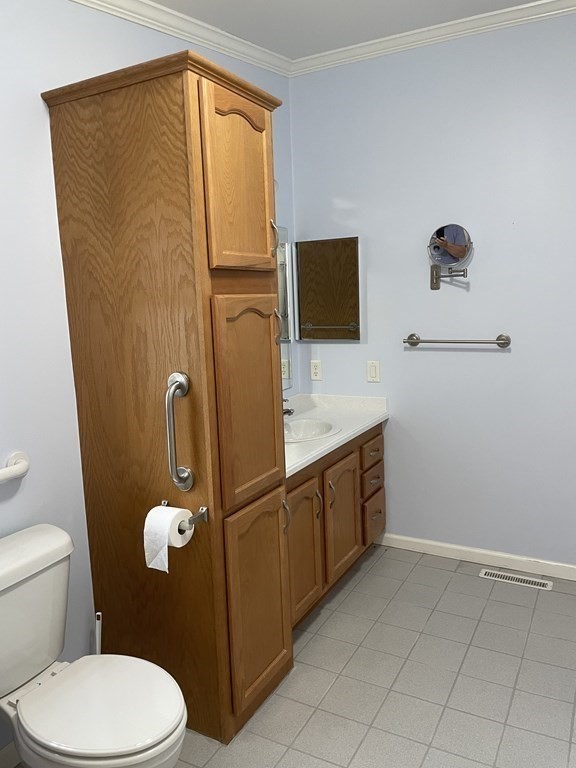 3006 Green Street Middleboro, MA 02346 - Photo 15 of 34 a bathroom with a granite countertop toilet sink and mirror