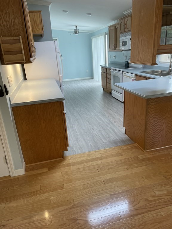 3006 Green Street Middleboro, MA 02346 - Photo 20 of 34 a kitchen with stainless steel appliances wooden floor and a refrigerator