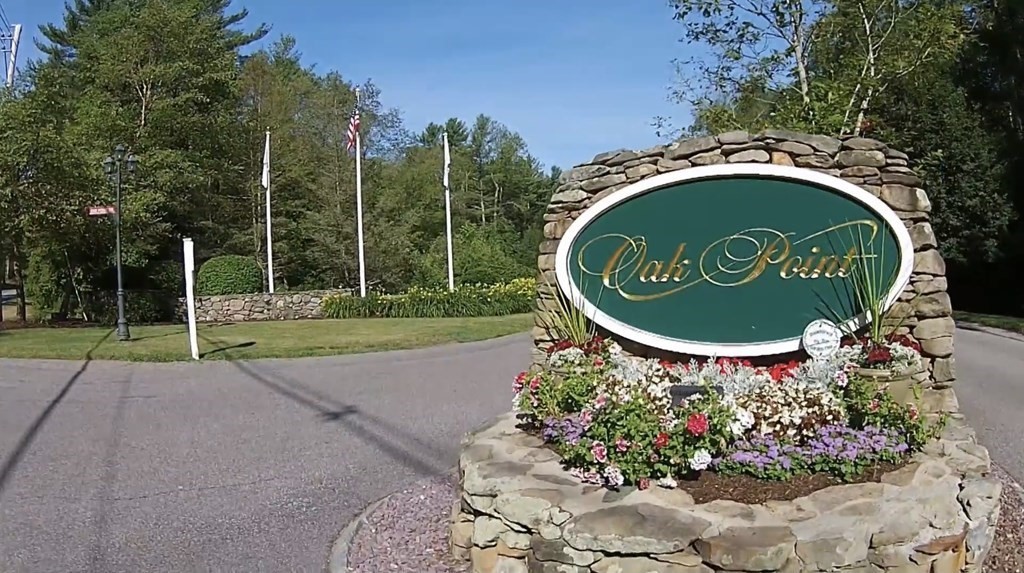 3006 Green Street Middleboro, MA 02346 - Photo 2 of 34 a sign that is sitting in front of a house with a small yard