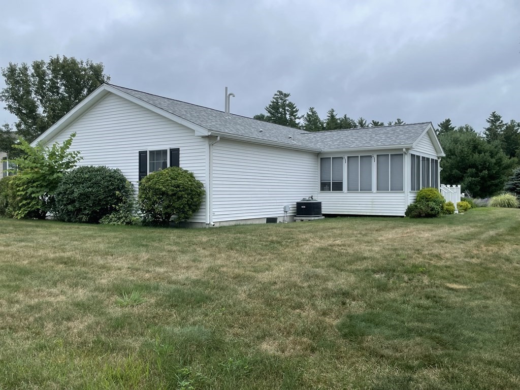 3006 Green Street Middleboro, MA 02346 - Photo 5 of 34 a front view of house with yard and trees in the background