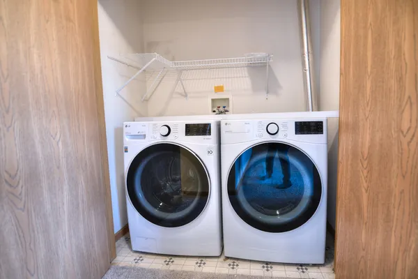 a utility room with dryer and washer