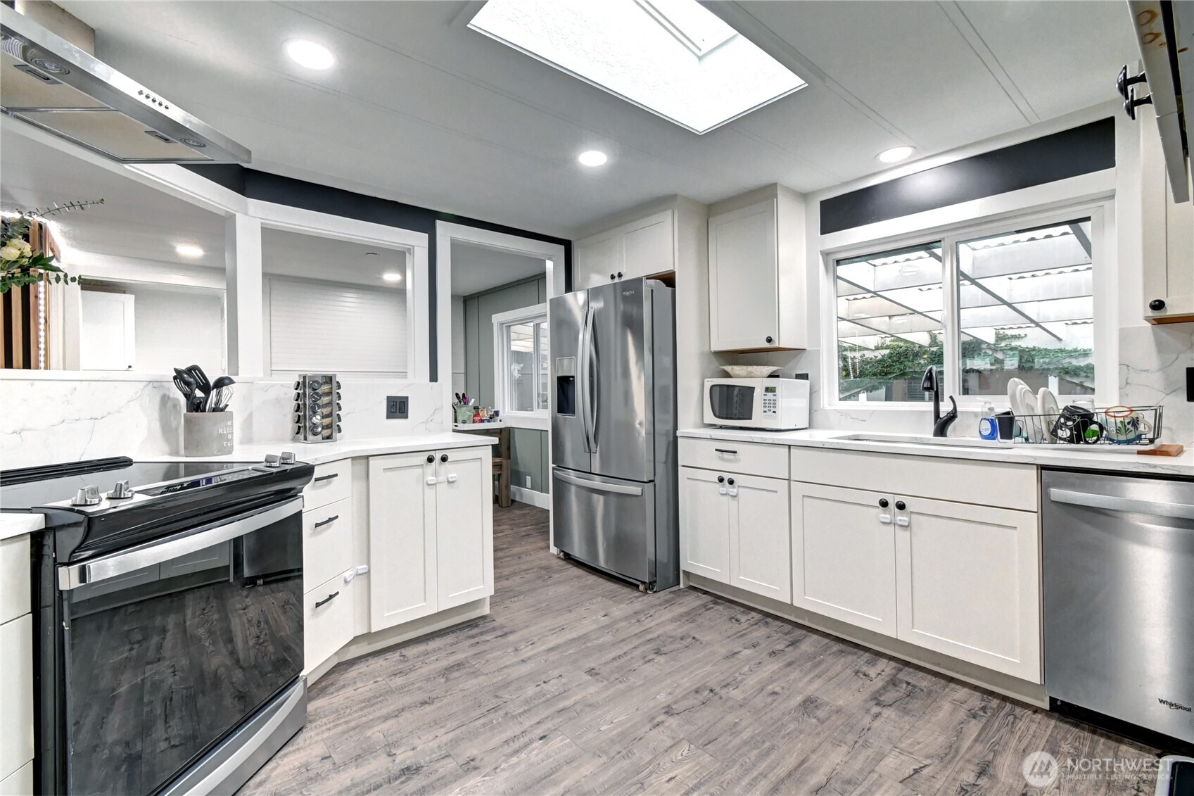 1615 208th Street Southeast, Unit 42 Bothell, WA 98012 - Photo 12 of 32 a kitchen with white cabinets and appliances