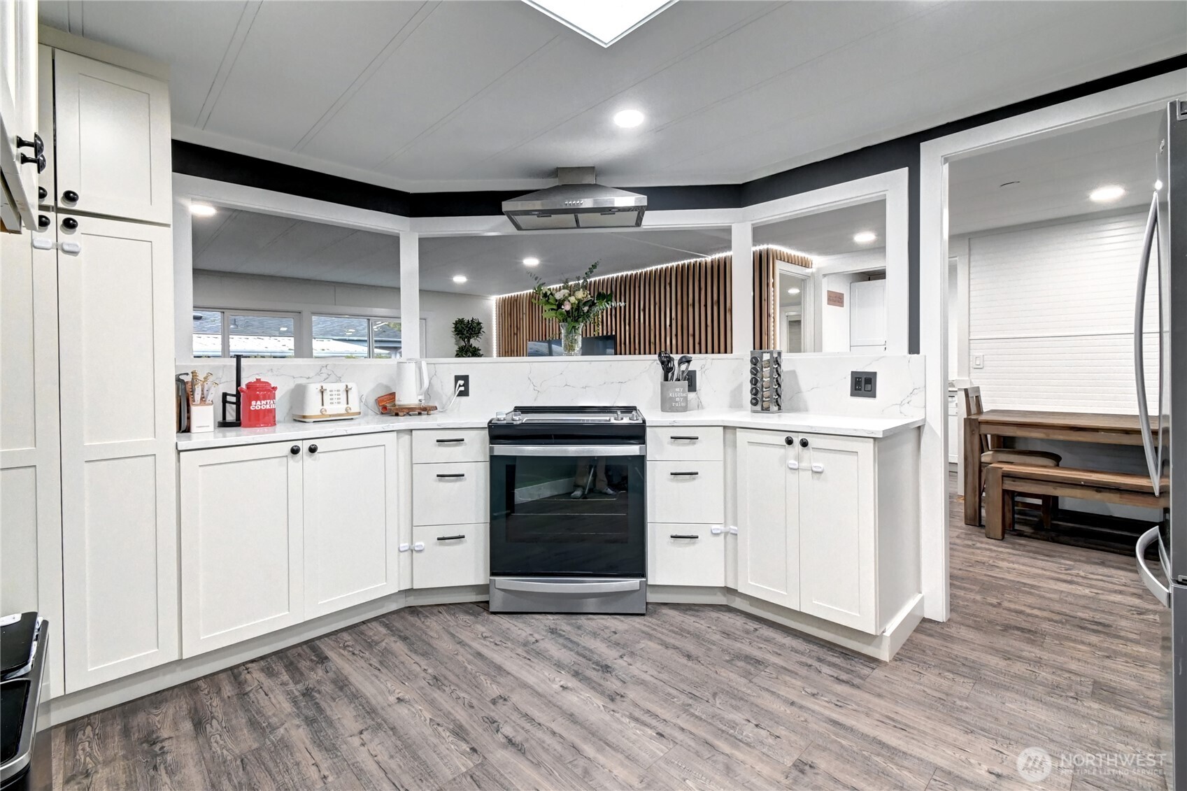 1615 208th Street Southeast, Unit 42 Bothell, WA 98012 - Photo 13 of 32 a kitchen with cabinets and wooden floor