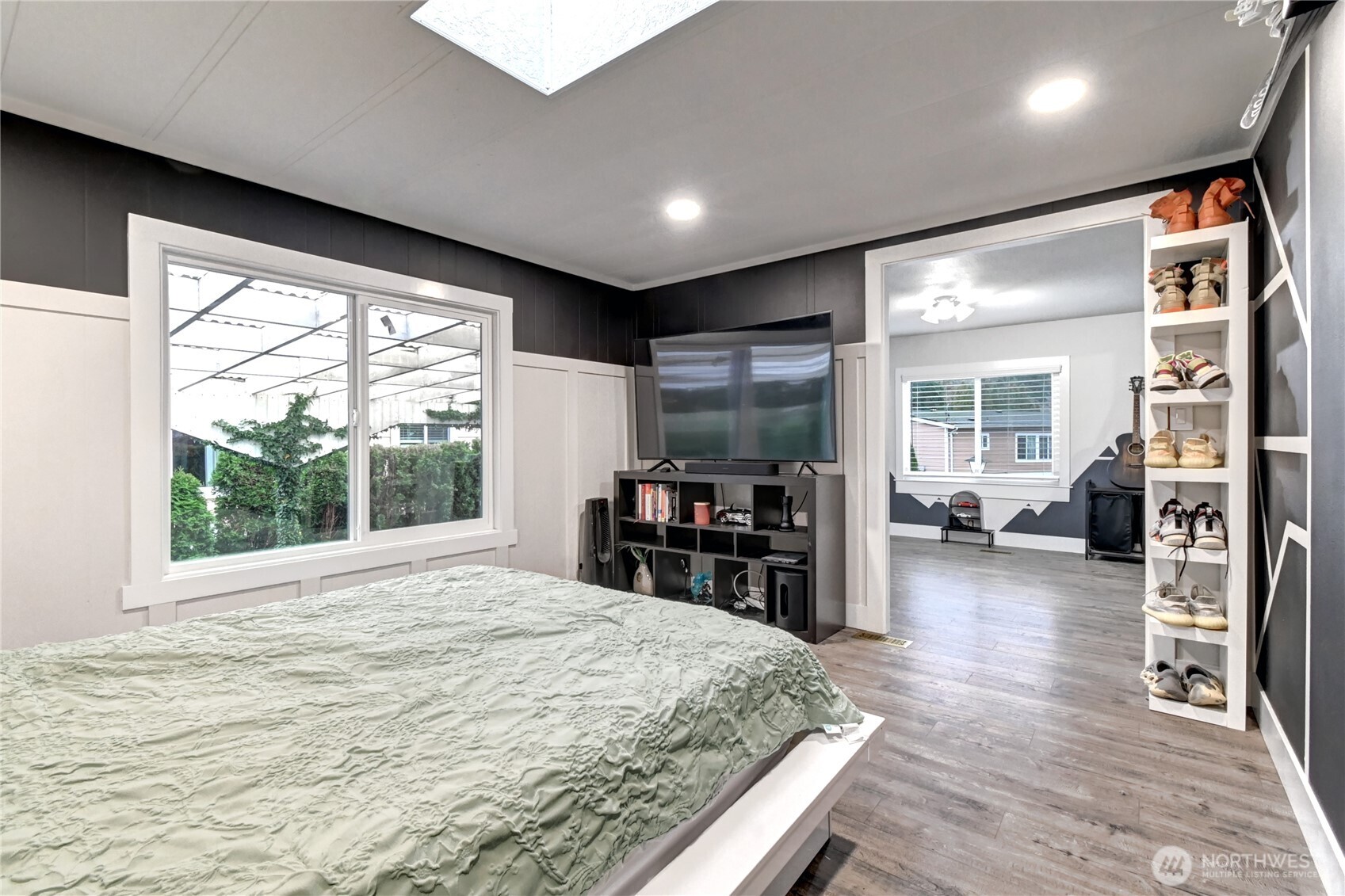 1615 208th Street Southeast, Unit 42 Bothell, WA 98012 - Photo 21 of 32 a room with furniture and a flat screen tv