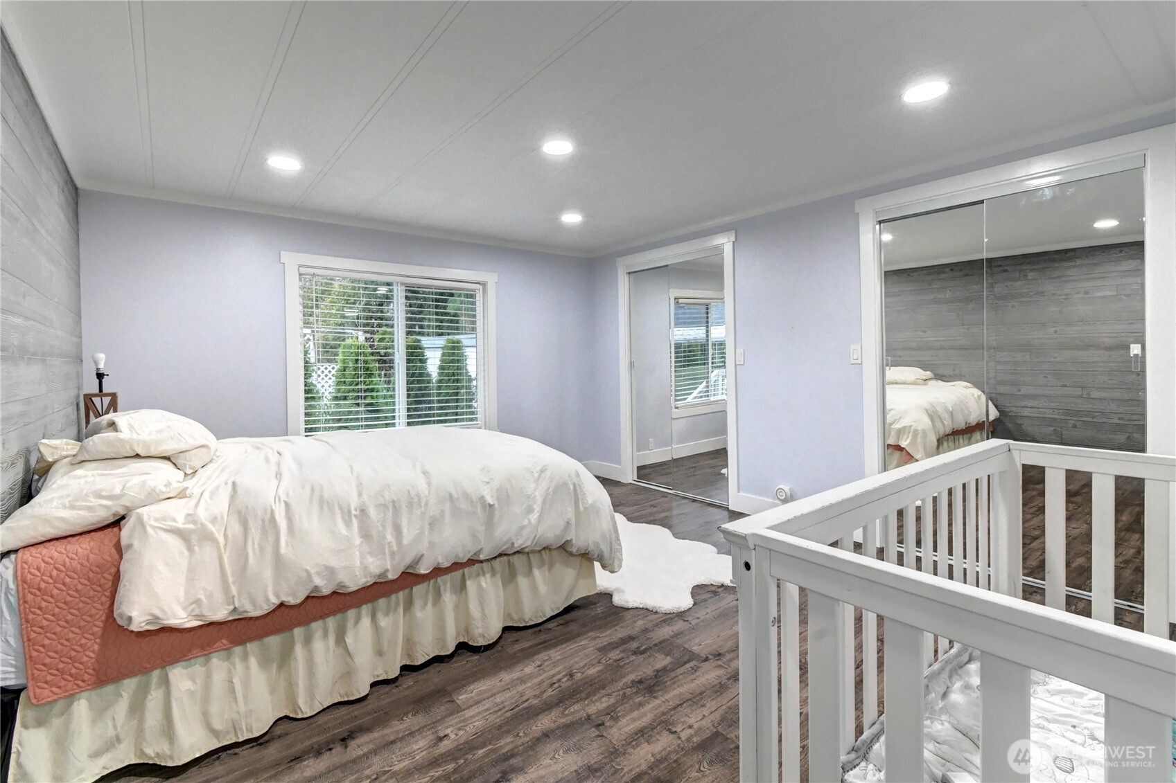 1615 208th Street Southeast, Unit 42 Bothell, WA 98012 - Photo 24 of 32 a bed sitting in a bedroom next to a window