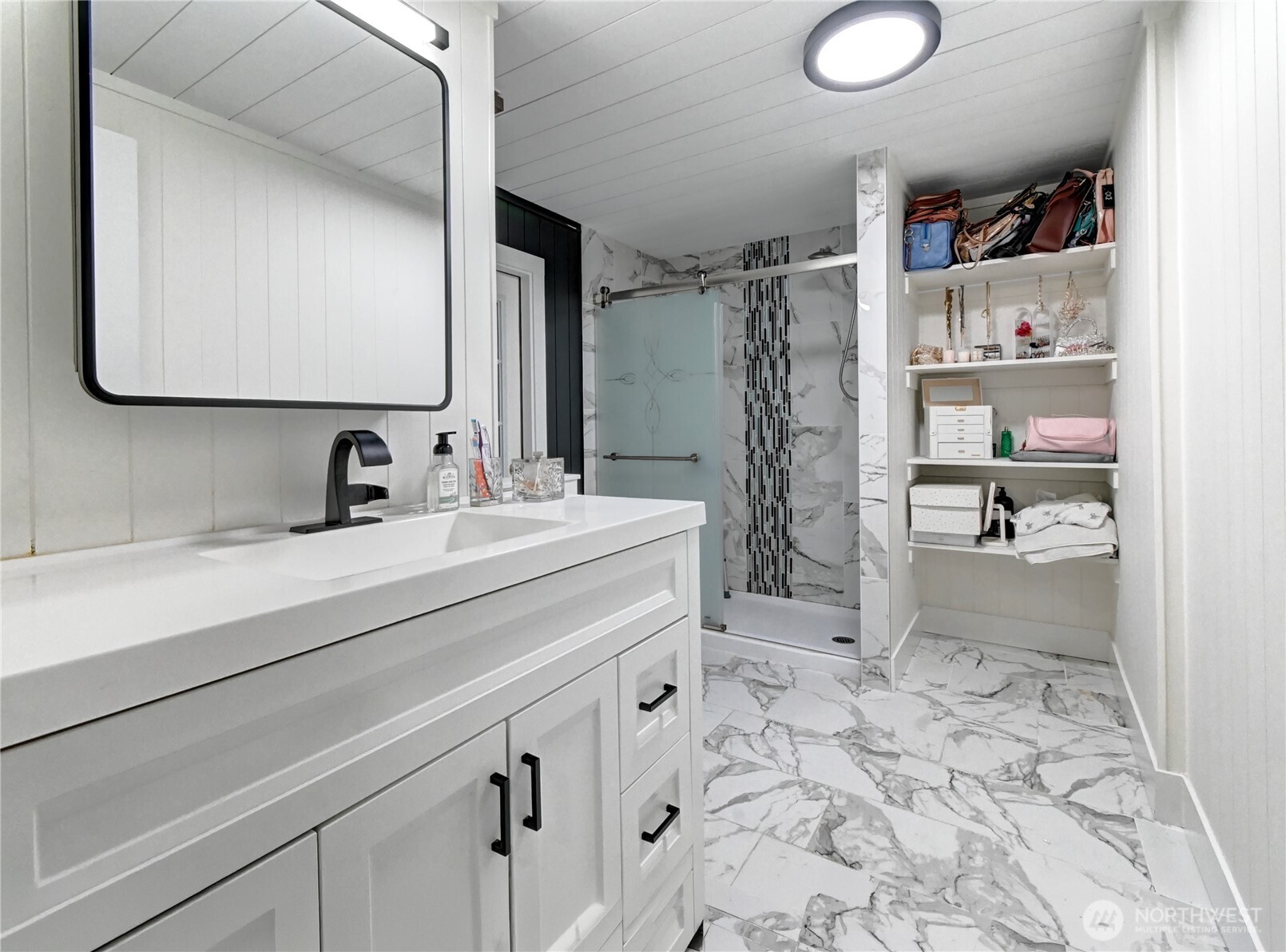 1615 208th Street Southeast, Unit 42 Bothell, WA 98012 - Photo 26 of 32 a bathroom with a sink a toilet and shower