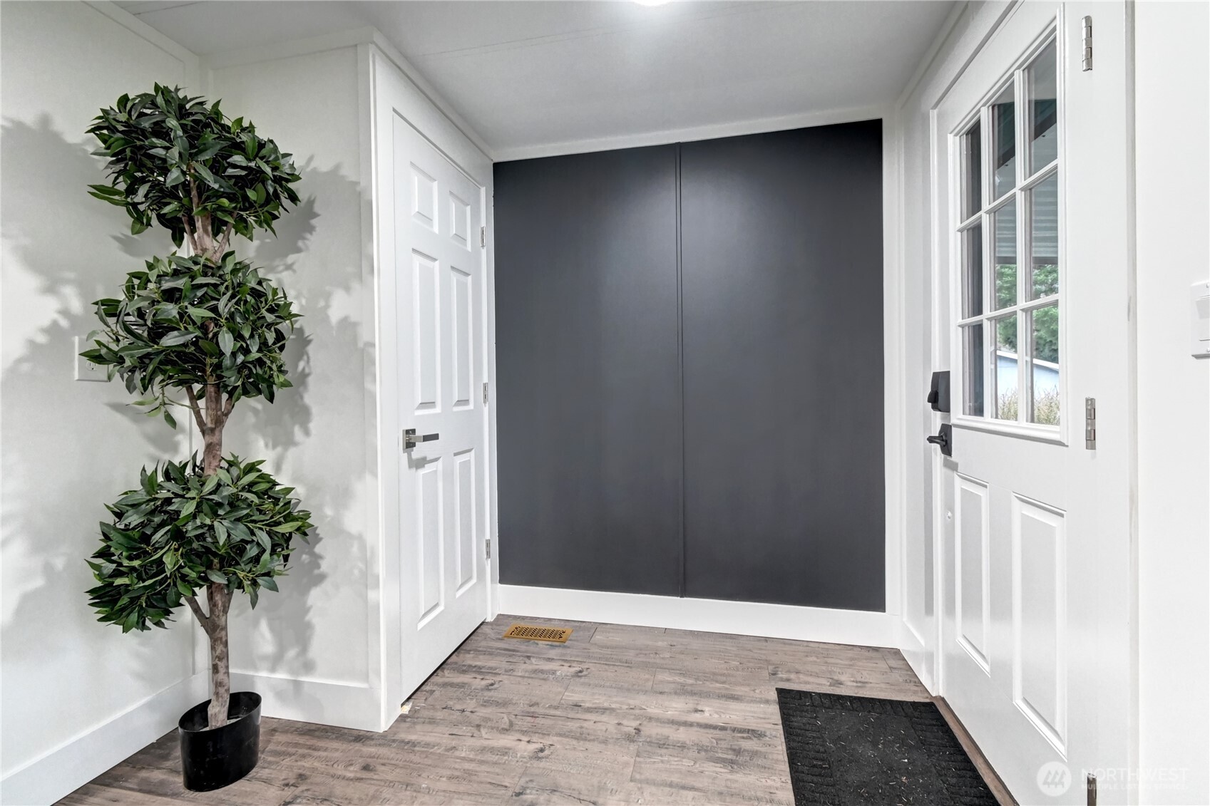 1615 208th Street Southeast, Unit 42 Bothell, WA 98012 - Photo 28 of 32 an empty room with a potted plant and a window