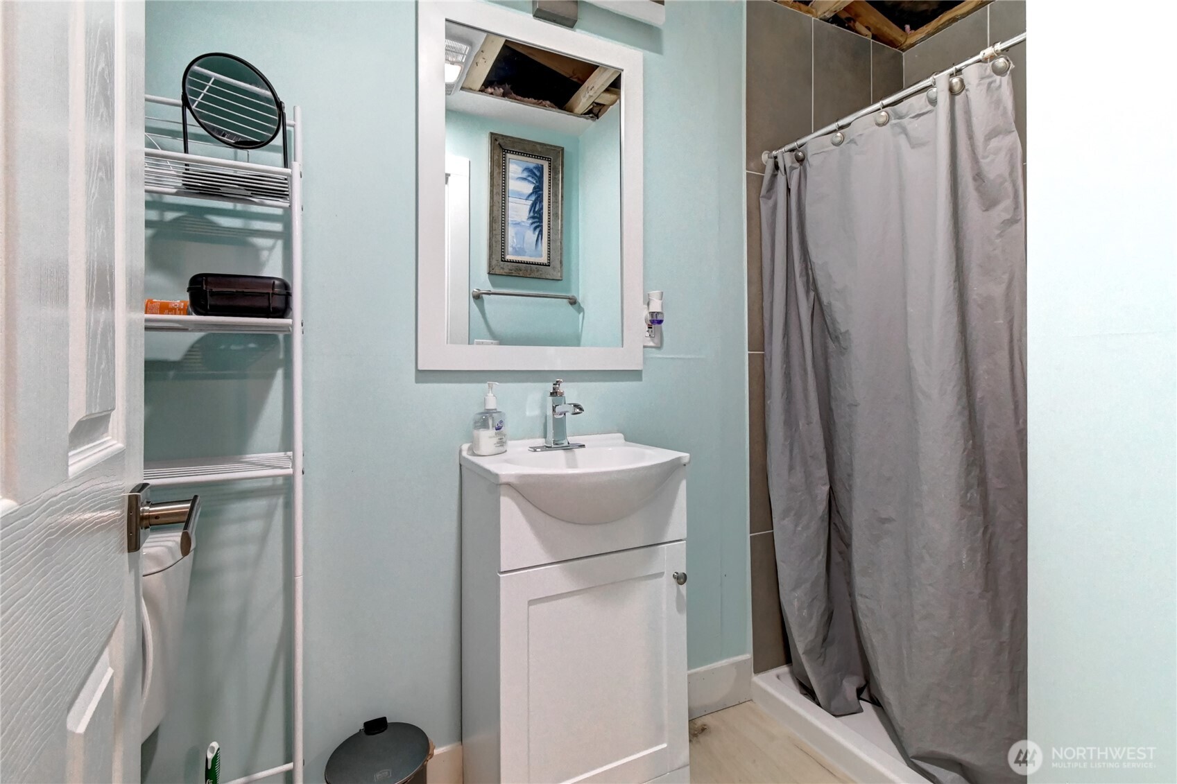 1615 208th Street Southeast, Unit 42 Bothell, WA 98012 - Photo 30 of 32 a bathroom with a sink a toilet and a mirror