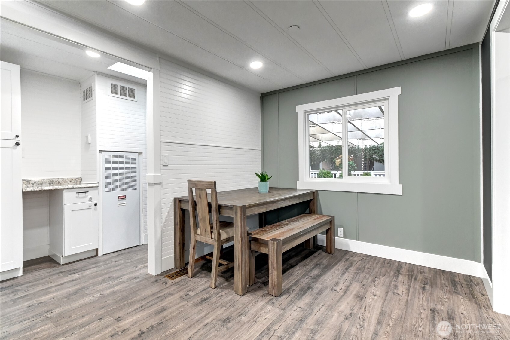 1615 208th Street Southeast, Unit 42 Bothell, WA 98012 - Photo 6 of 32 a view of a workspace with furniture and wooden floor
