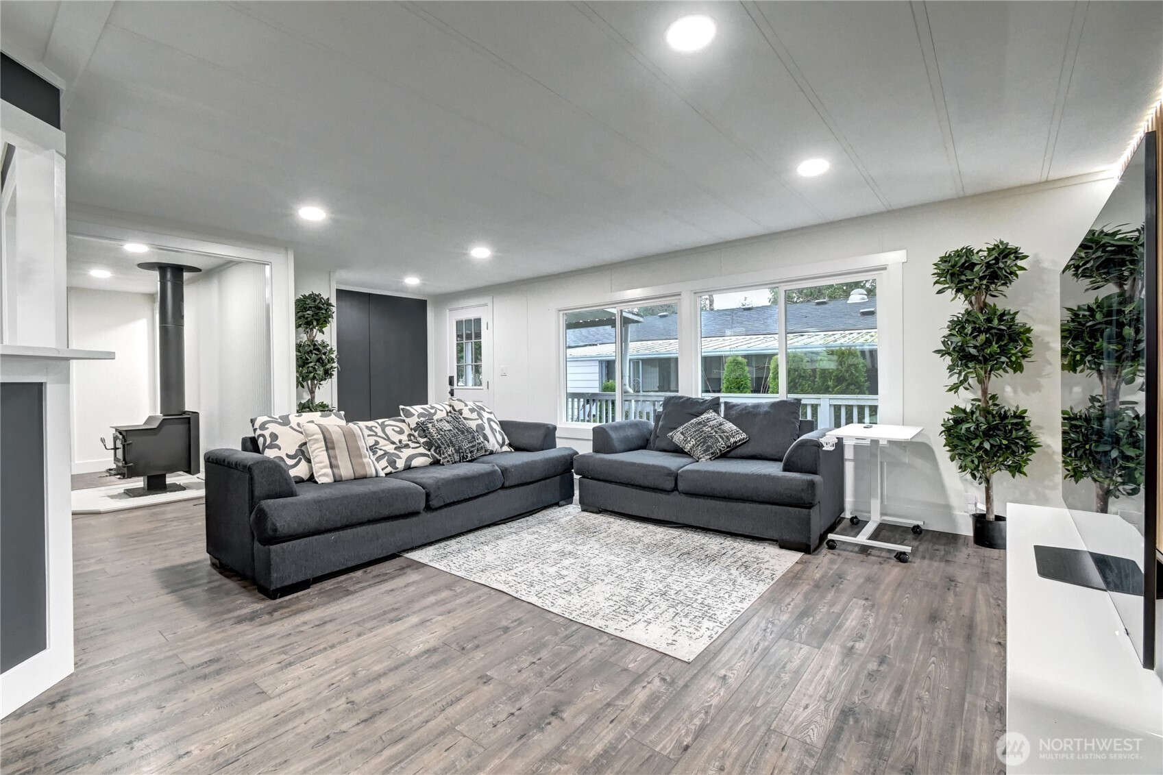 1615 208th Street Southeast, Unit 42 Bothell, WA 98012 - Photo 7 of 32 a living room with furniture and a large window