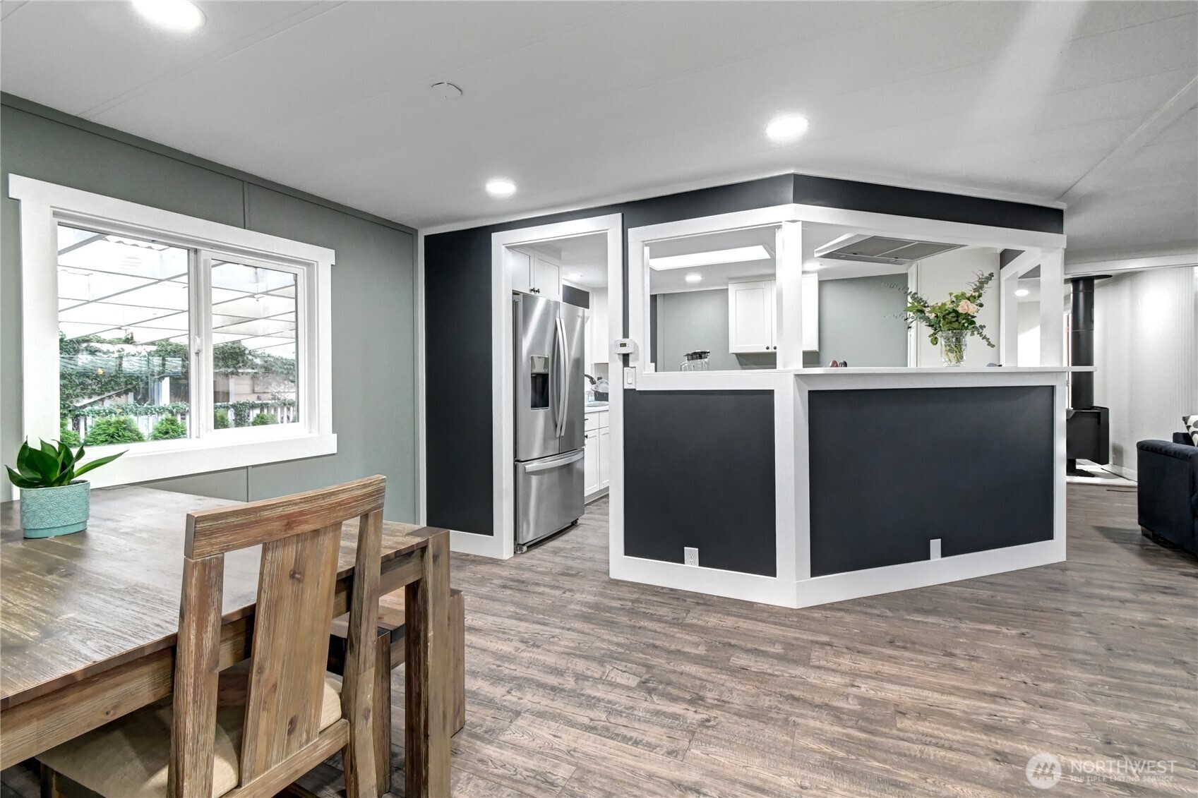 1615 208th Street Southeast, Unit 42 Bothell, WA 98012 - Photo 10 of 32 a view of kitchen with stainless steel appliances granite countertop cabinets and wooden floor