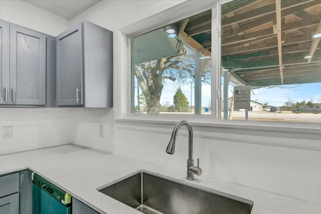 a kitchen with a sink and a window