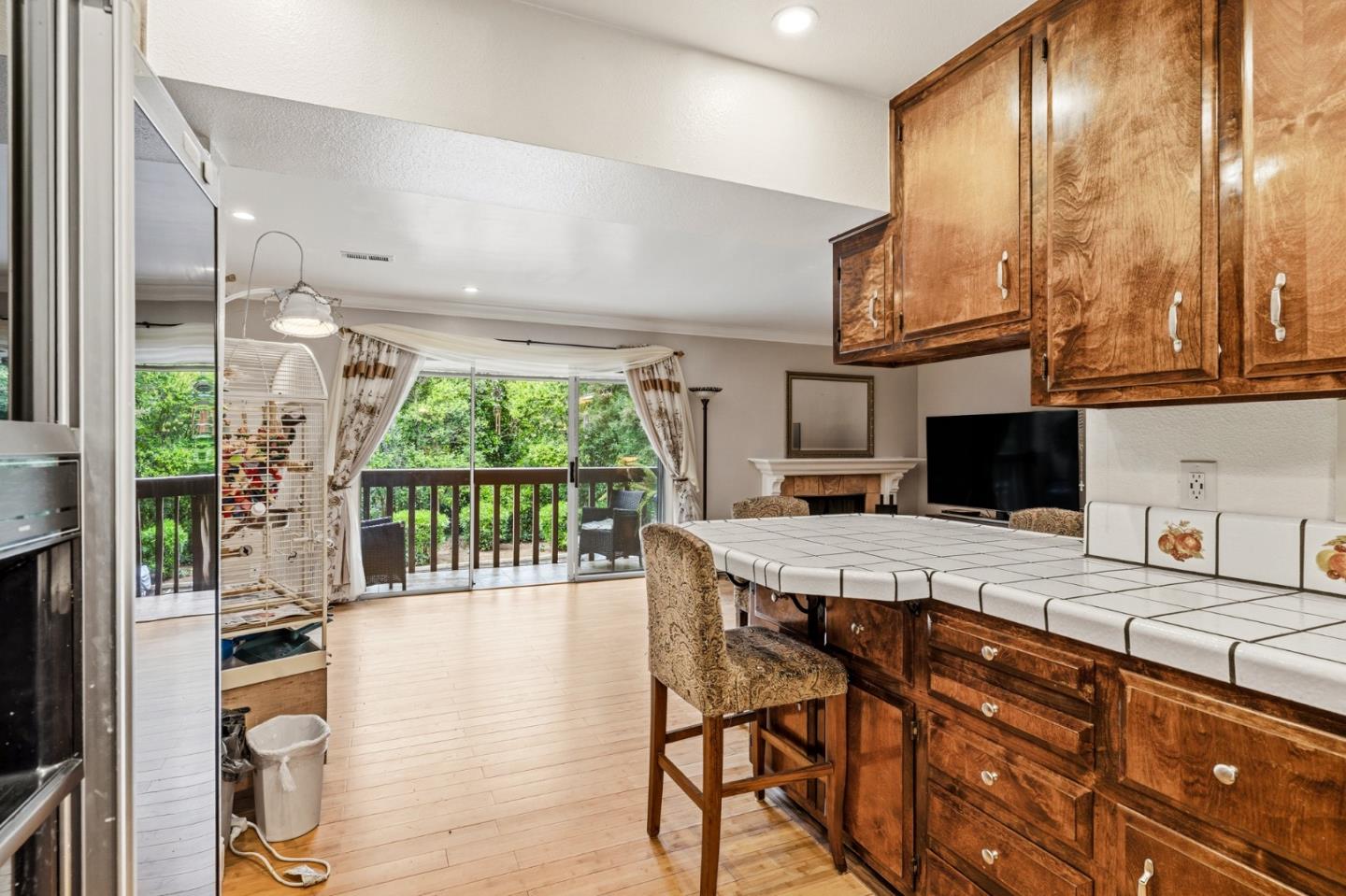 1743 Panda Way Hayward, CA 94541 - Photo 20 of 34 a kitchen with a table chairs and a flat screen tv