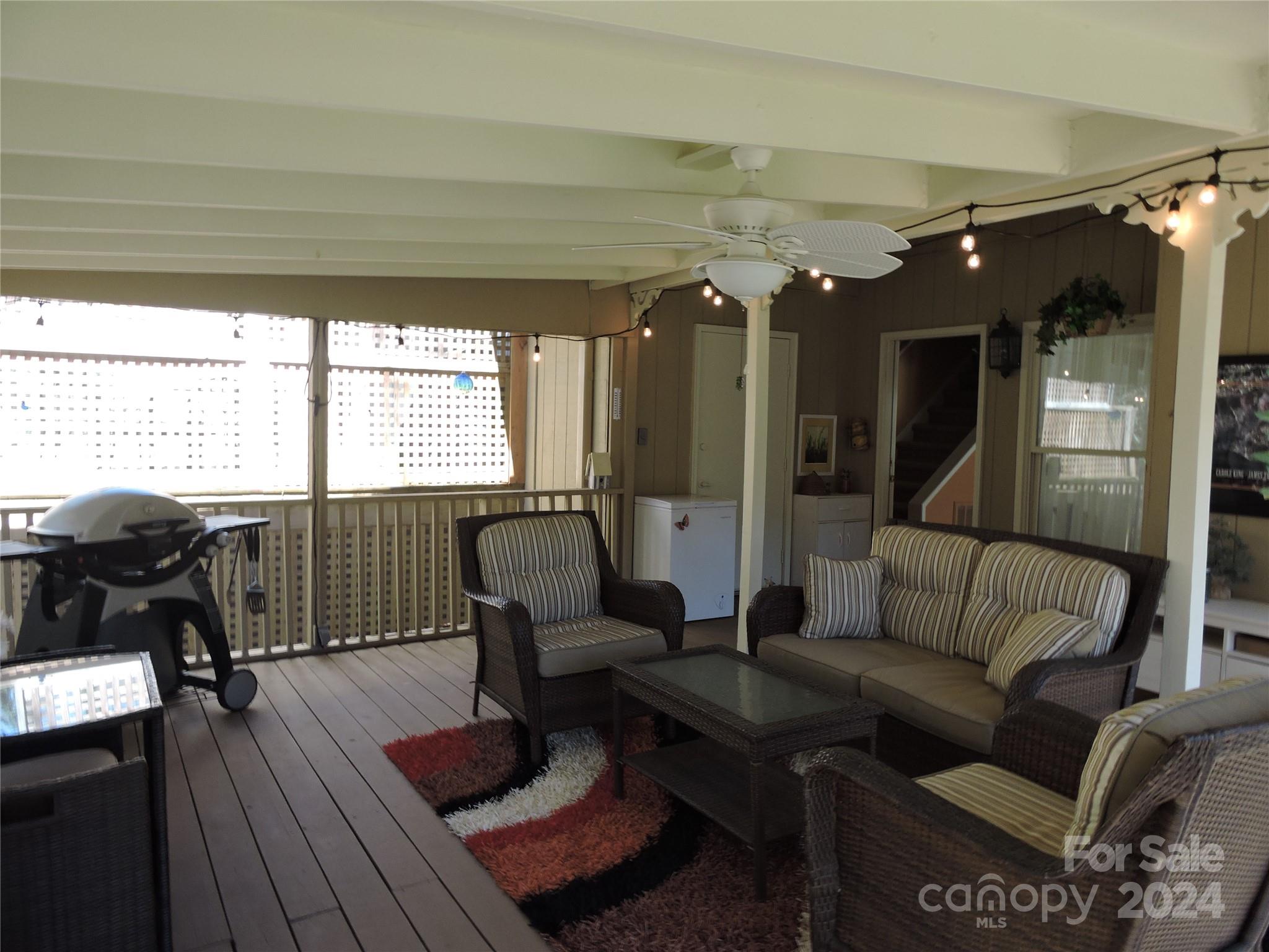 329 Riddle Cove Road Maggie Valley, NC 28751 - Photo 18 of 22 a living room with furniture and a large window