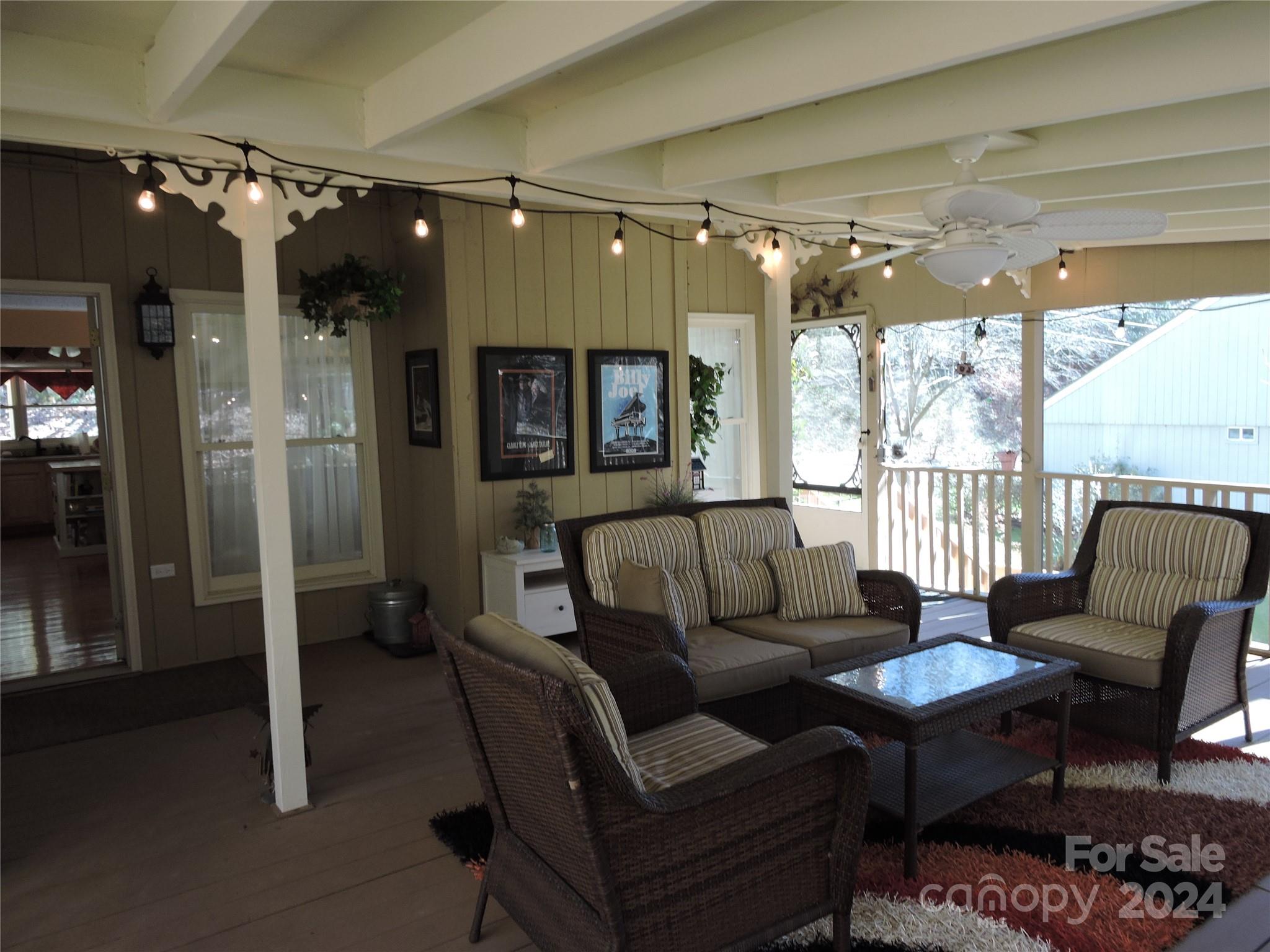 329 Riddle Cove Road Maggie Valley, NC 28751 - Photo 19 of 22 a living room with furniture and a large window