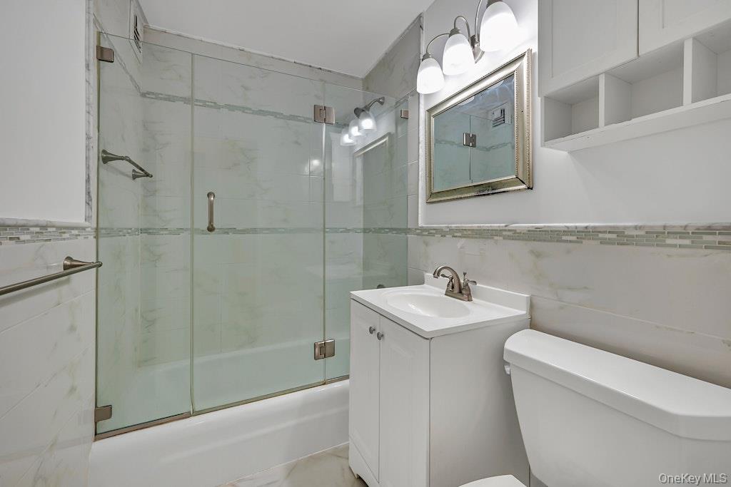 108 Sagamore Road, Unit 5E Tuckahoe, NY 10707 - Photo 21 of 23 a bathroom with a sink toilet and shower