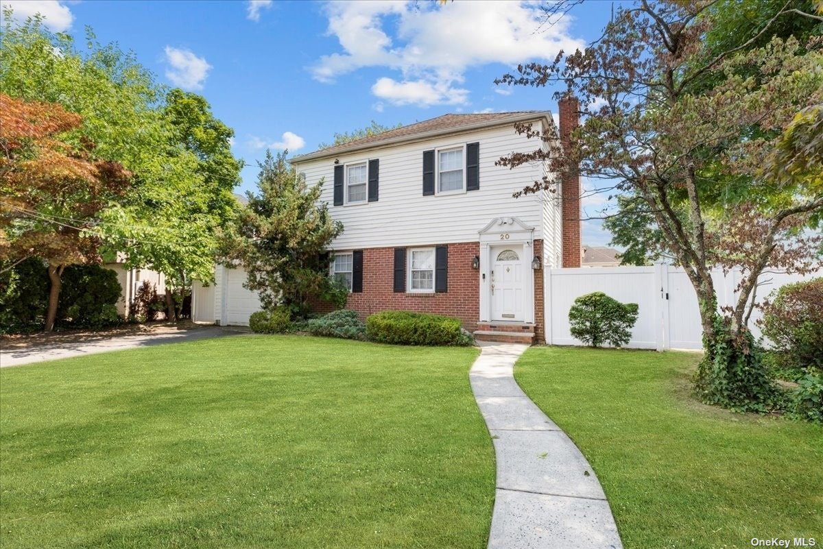 20 Adele Road Cedarhurst, NY 11516 - Photo 1 of 1 a front view of a house with a yard
