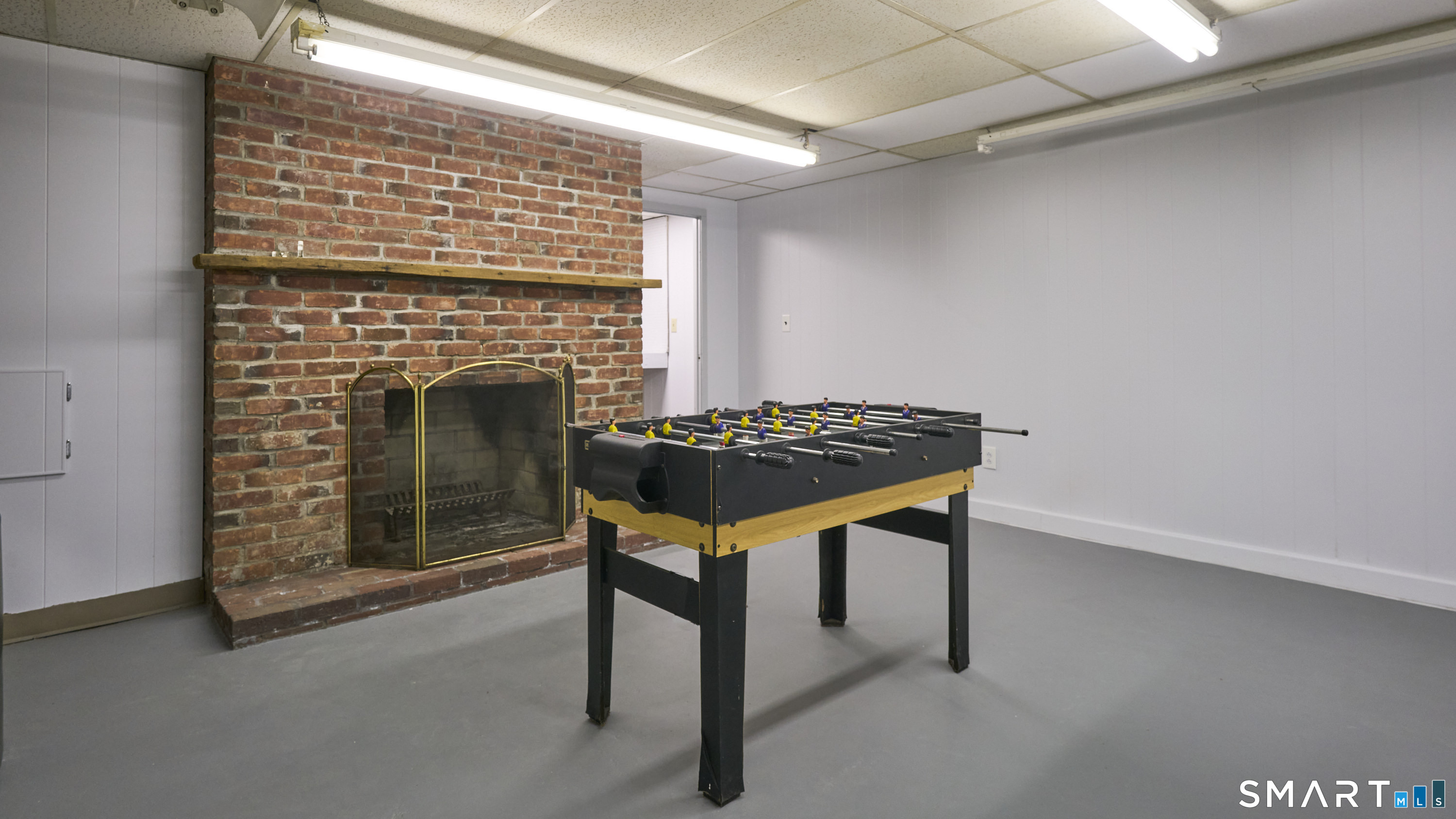 15 Haywardville Road East Haddam, CT 06423 - Photo 38 of 40 Lower-level entertainment perspective - Fireplace character and activity zones - creates memorable game-night atmosphere.