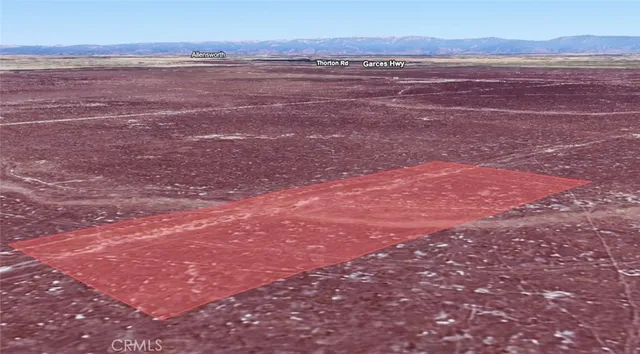 a view of an ocean with a mountain