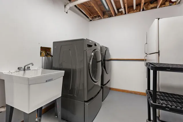 a view of a patio with a wooden fence