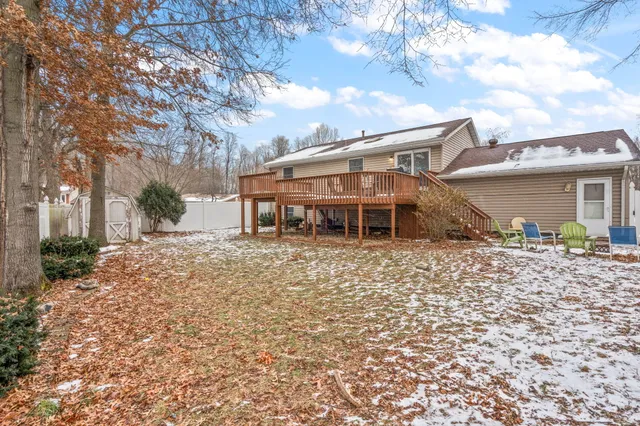 a view of a patio with a yard