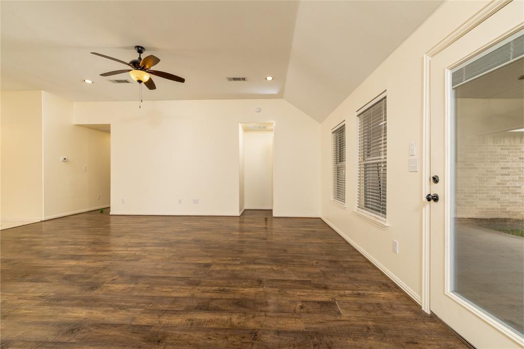 405 Kimbrough Road Azle, TX 76020 - Photo 7 of 39 a view of empty room with wooden floor and fan