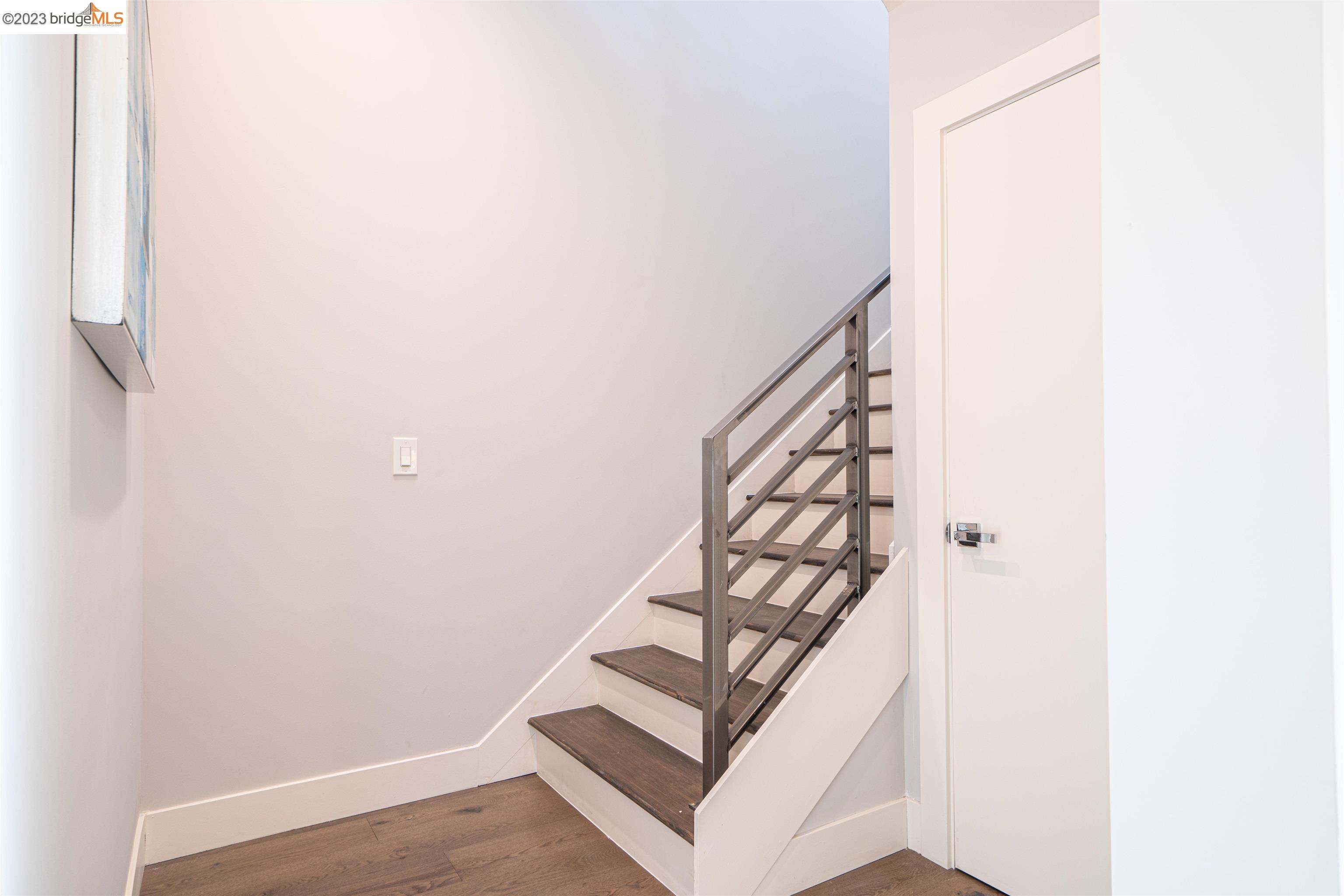 1679 12th Street Oakland, CA 94607 - Photo 11 of 26 a view of staircase with white walls and white walls