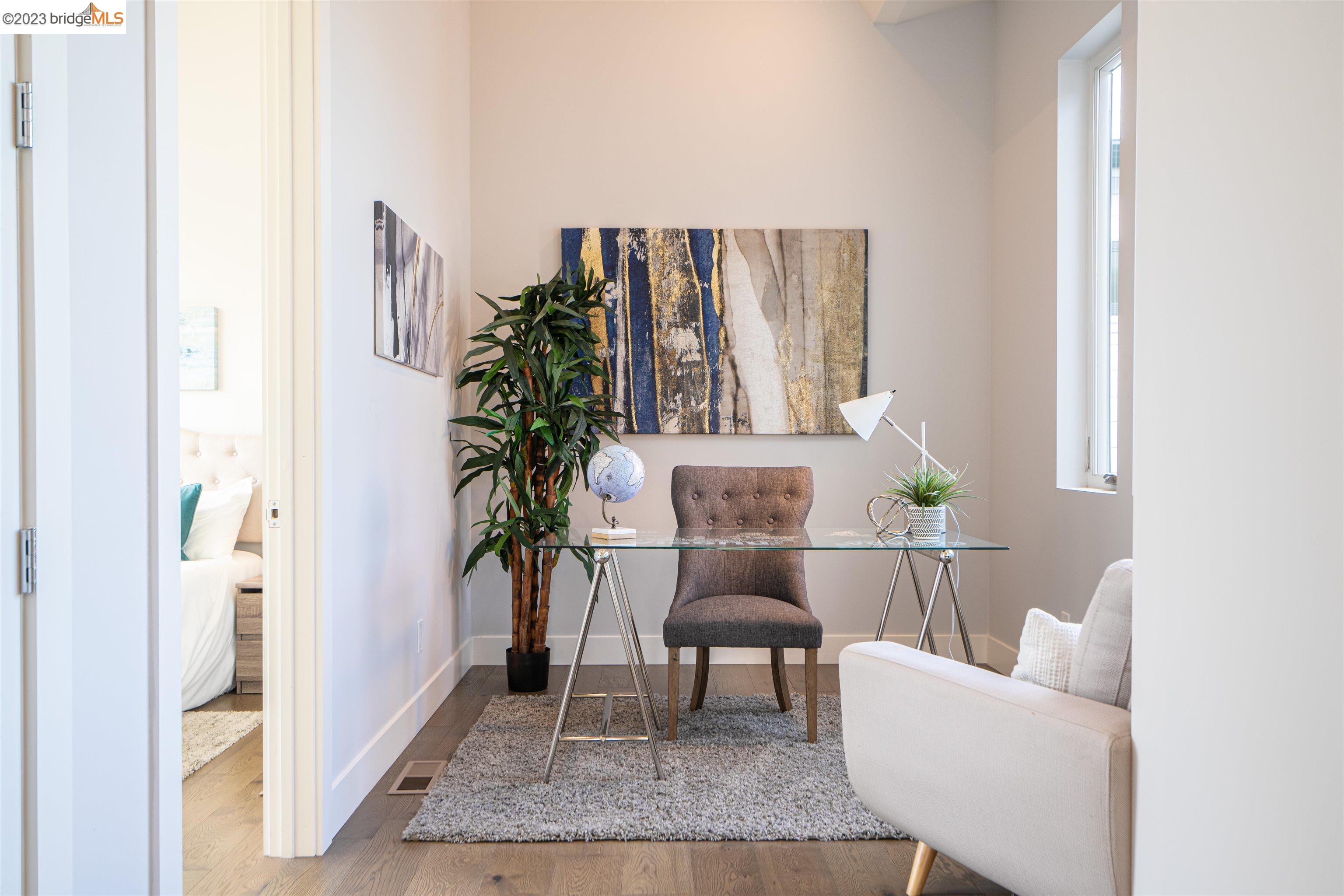 1679 12th Street Oakland, CA 94607 - Photo 14 of 26 a living room with furniture and a potted plant