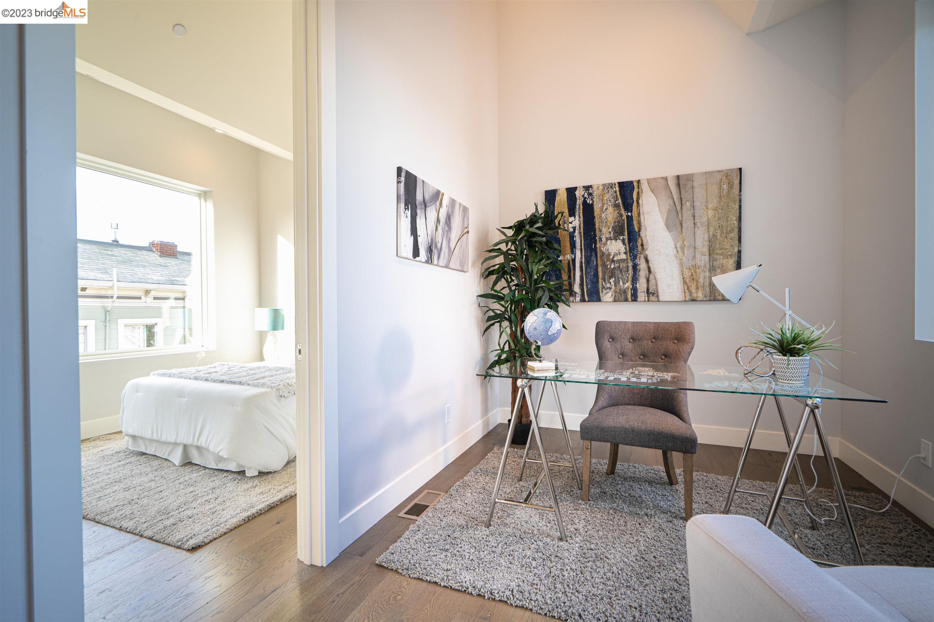 1679 12th Street Oakland, CA 94607 - Photo 15 of 26 a living room with furniture and wooden floor