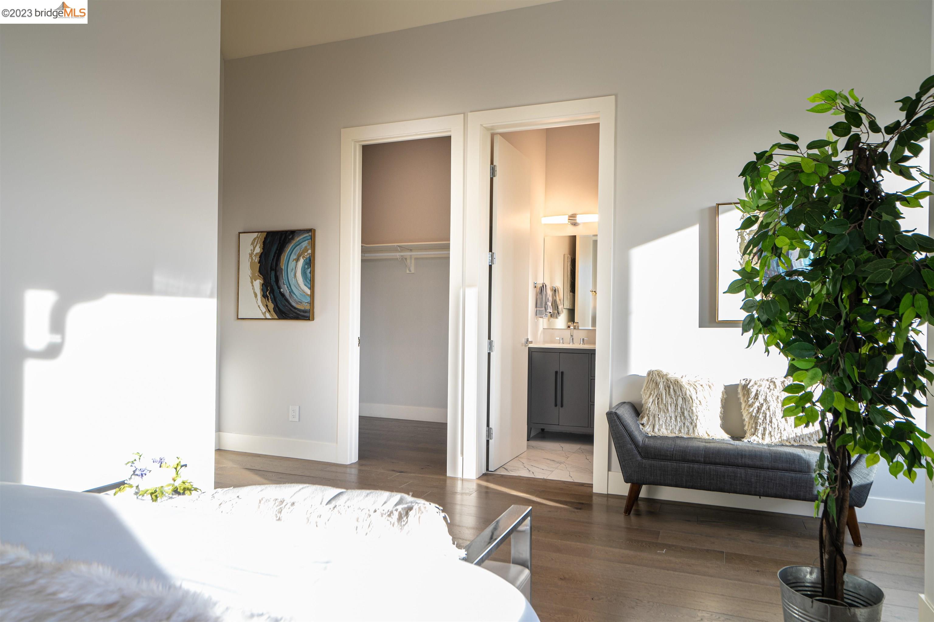 1679 12th Street Oakland, CA 94607 - Photo 19 of 26 a living room with furniture and a potted plant