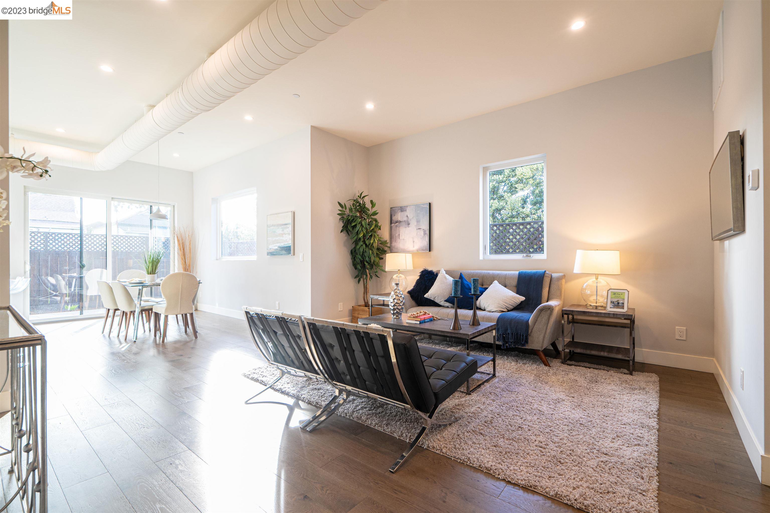 1679 12th Street Oakland, CA 94607 - Photo 2 of 26 a living room with furniture and a wooden floor