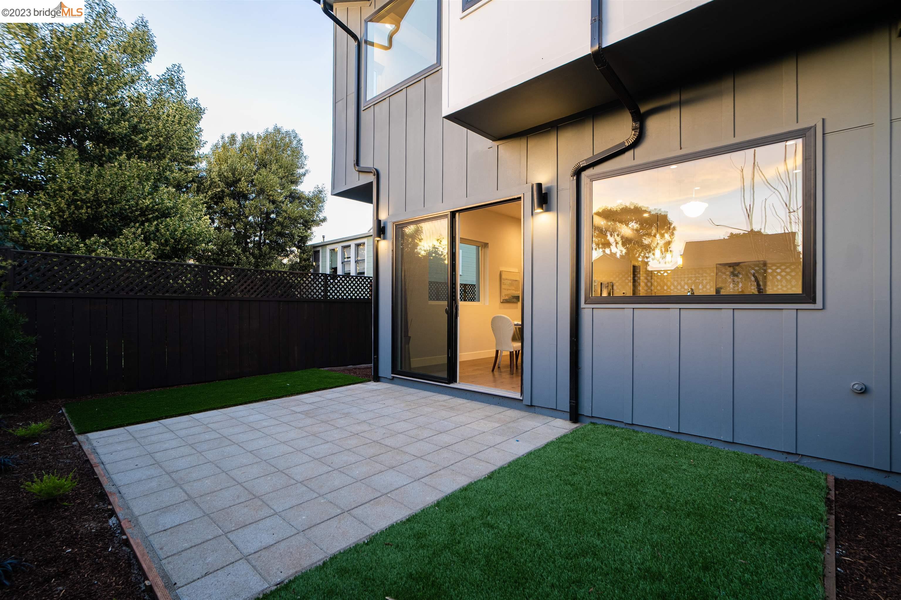 1679 12th Street Oakland, CA 94607 - Photo 26 of 26 a view of a porch with wooden floor and a yard