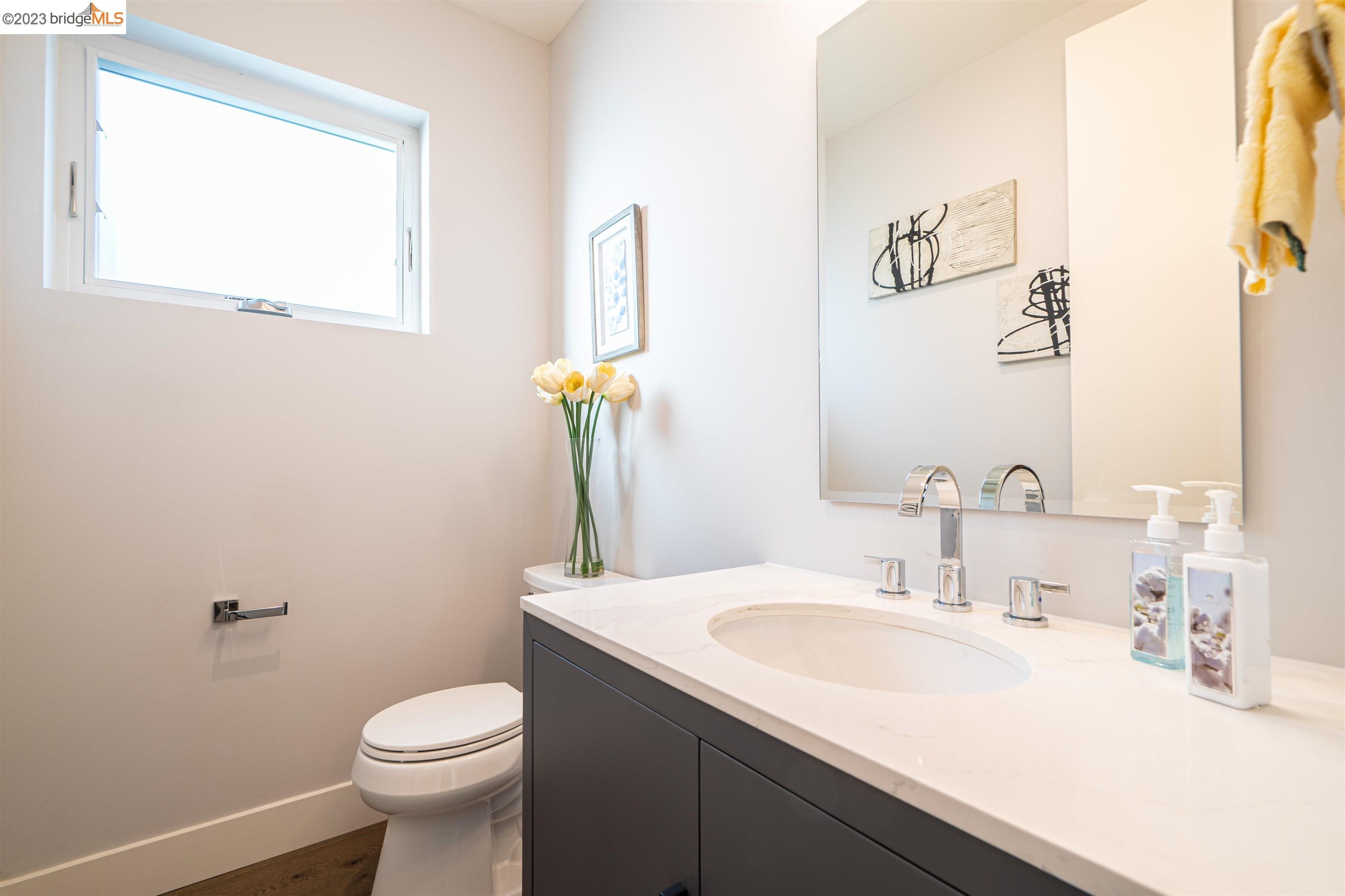 1679 12th Street Oakland, CA 94607 - Photo 10 of 26 a bathroom with a sink and a toilet