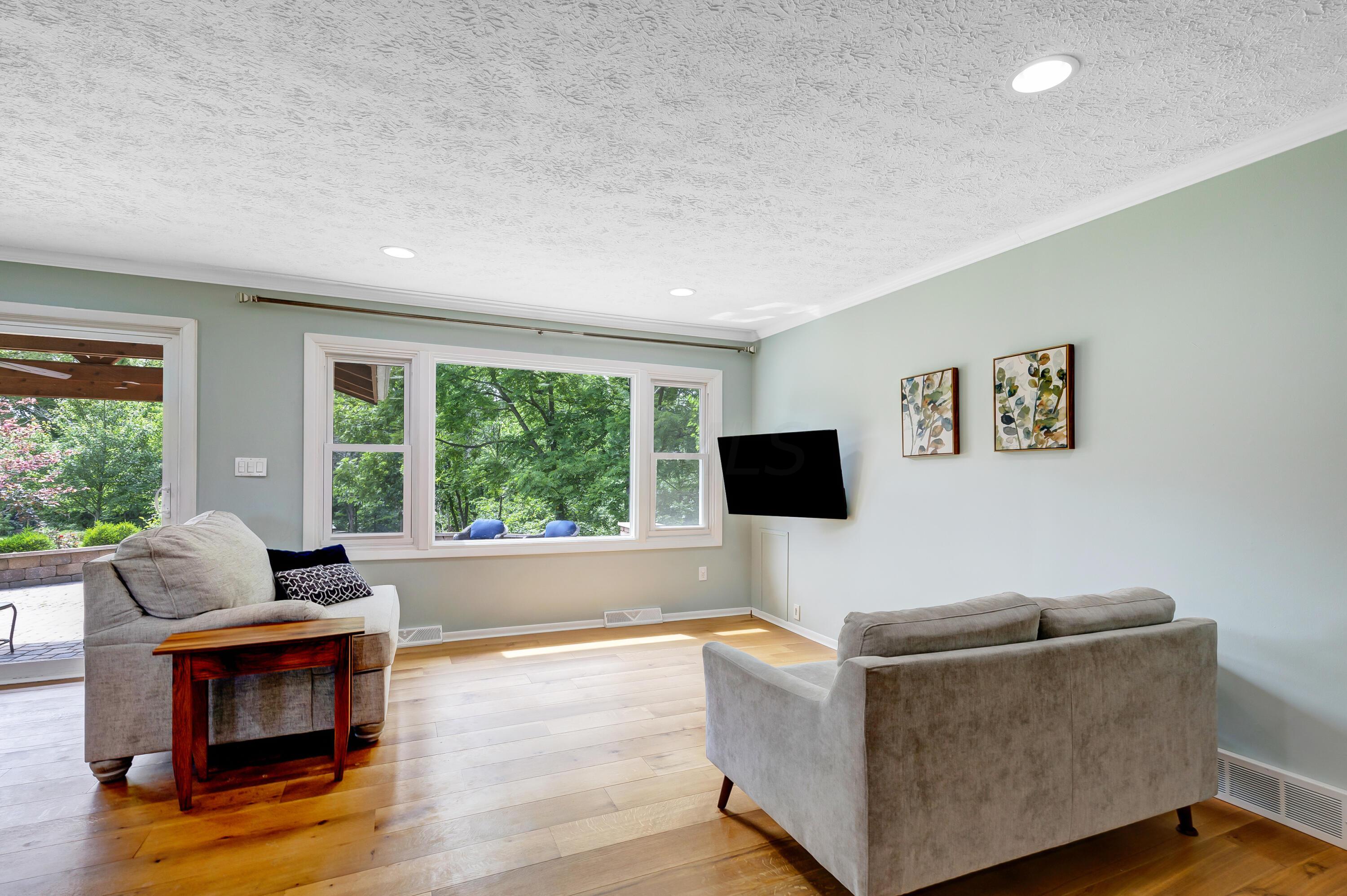 3324 Sunbury Road Galena, OH 43021 - Photo 3 of 56 • New White Oak Flooring ~ 2014/2015 • Sage Painted Walls • Crown Molding • Can Lighting • Large Picture Window