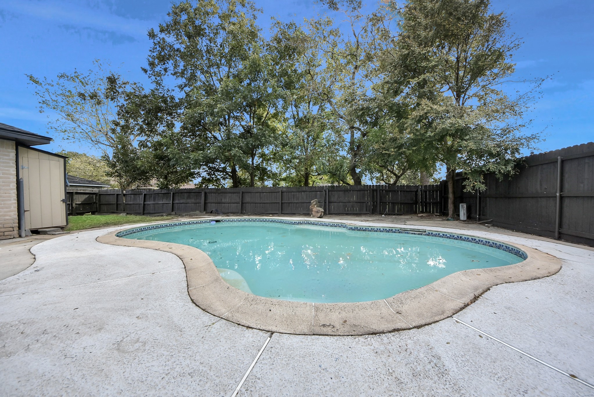 a view of a pool in a yard