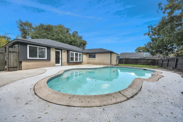 a view of a house with a swimming pool