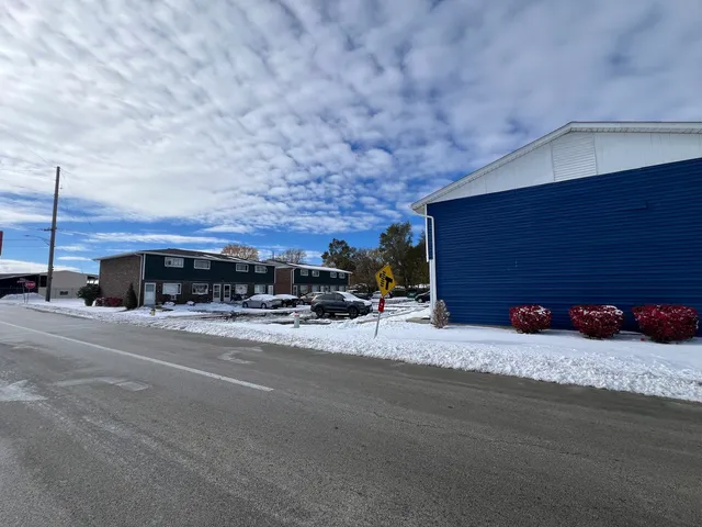 a view of a car parked in front of a house