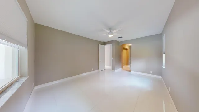 a view of empty room with windows