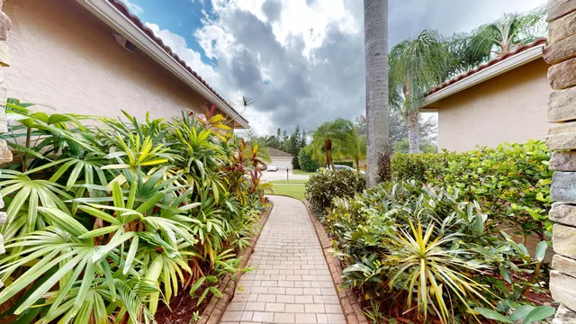a view of a hallway with bathroom and front door