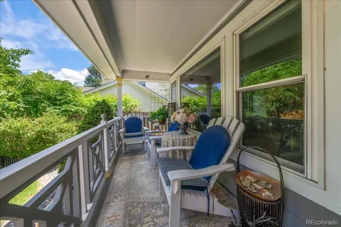 a view of balcony with furniture